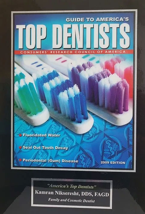 Book cover titled 'Top Dentists' with an image of a dental hygiene product and text.