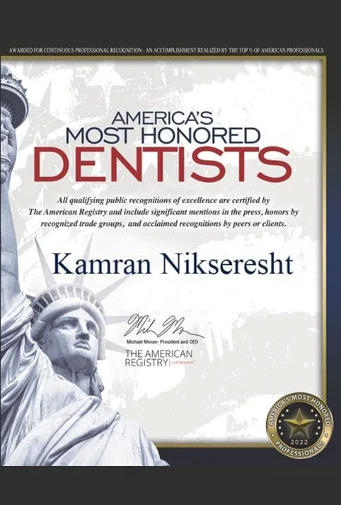 The image displays a certificate or award for  America s Most Honored Dentists  with the name Kamran Nikseresht at the bottom, indicating recognition for dental professionals in America.